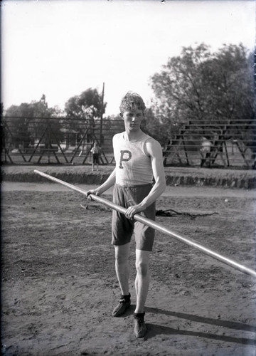 Track and field athlete pole vaulting